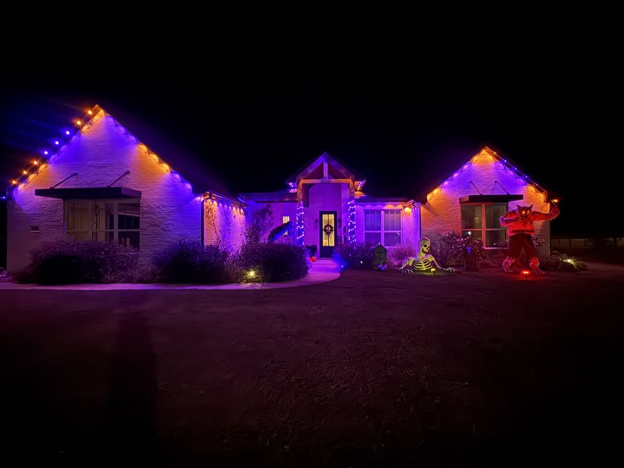 Home lit purple and orange for Halloween
