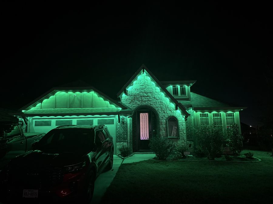 The same home lit in green